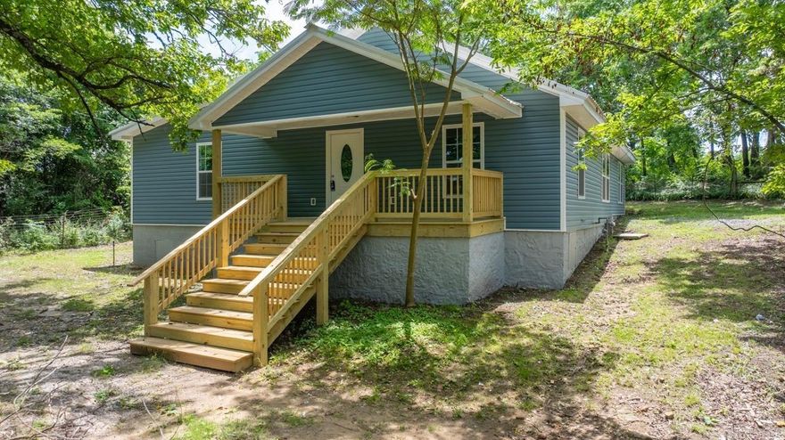 Welcome to 915 Bethesda Rd. in Batesville, AR—where quality, comfort, and opportunity come together. This 3 bed, 2 bath home has been fully remodeled from the studs up and offers nearly 1,976 sq ft of thoughtfully designed living space. Enjoy a bright open floor plan, large kitchen with a custom breakfast bar, beautiful wood cabinetry, epoxy countertops, and all-new fixtures, trims, and paint. The bedrooms are spacious, and both bathrooms are oversized and modern. Sitting on approx. 4.75 cleared more or less acres with a private driveway, storm shelter, and TWO access points, the land is ready for your next move—with septic, city water, and electric already in place for a second home, mobile, or shop. Just minutes from town, yet perfectly private—this property is full of potential!