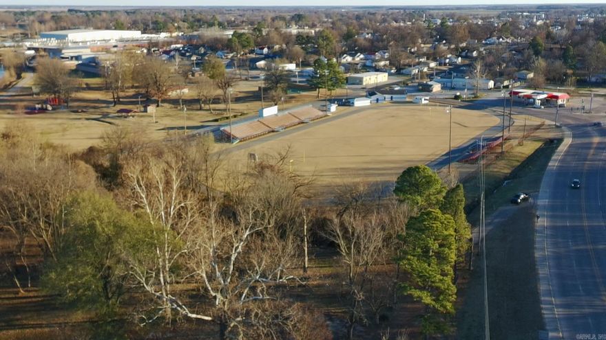 Bring your vision to life on this 2.79± acre commercial tract ideally positioned near the heart of Paragould. Located right next to Harmon Park and adjacent to the popular 8-mile walking/hiking track, this property offers a standout setting with built-in foot traffic and a park-side atmosphere that’s hard to find. The lot features a mix of open space and mature trees, giving you flexibility for development while keeping a natural, attractive feel. Whether you’re planning retail, office, service, or a destination-style concept, this is a high-visibility, high-potential location in a growing area—perfect for your next commercial project.