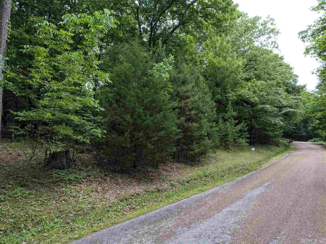 Large and private Eden Isle lot! This .74 acre lot is at the end of Sugar Maple Drive and is very secluded. The property can be accessed from Rock Ledge Road from the top side of the lot. All utilities including public water and sewer, natural gas, electric and cable are on the property. Walking distance to Eden Isle Marina and the Red Apple Inn. Absolutely beautiful property!