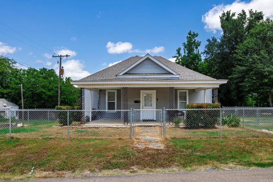 This charming two-bedroom, two-bath home sits on an oversized lot and offers the perfect blend of comfort and functionality. Inside, you'll find tall ceilings that create a spacious and airy feel throughout. The layout includes a cozy breakfast area for casual mornings as well as a formal dining room ideal for hosting gatherings or special occasions. Outside, the fully fenced-in yard provides privacy and plenty of room to enjoy the outdoors, whether it’s gardening, entertaining, or simply relaxing. This property is a wonderful opportunity for anyone seeking space, character, and versatility in a home.