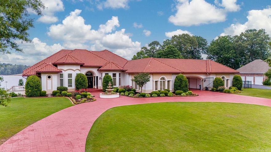 This Hurricane Lake home is truly a luxurious retreat with STUNNING LAKE VIEWS, a plethora of outdoor amenities, & a dreamy interior! With a new infinity pool & hot tub, an outdoor kitchen, a 2-stall covered boat dock, and a basketball court, this home is an entertainer's dream! The main part of the house boasts an open-concept, newly-remodeled kitchen & family room! The kitchen features a gas cooktop, 2 ovens, an ice maker, other top-of-the line appliances, granite countertops, & a spacious breakfast bar. The primary suite is a sanctuary with beautiful lake views, 2 walk-in closets, a fully remodeled bathroom including a custom tiled shower, soaker tub & double vanities! Add'l features include a formal dining room, coffered ceiling in the living room, office with built-ins, a huge MOVIE ROOM with seating & wet bar, 2 add'l bedrooms with their own baths, & a large laundry room! The upper level can serve as a full in-law suite, complete with a separate entrance, a full kitchen, 2 bedrooms, each with their own baths, a private balcony, and a bonus room area! 3+ car garage, sprinkler system & more! This home is perfect for those seeking a blend of luxury & comfort. Agents see remarks!