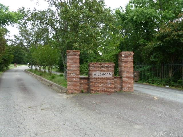 Sloping wooded lot in great neighborhood.