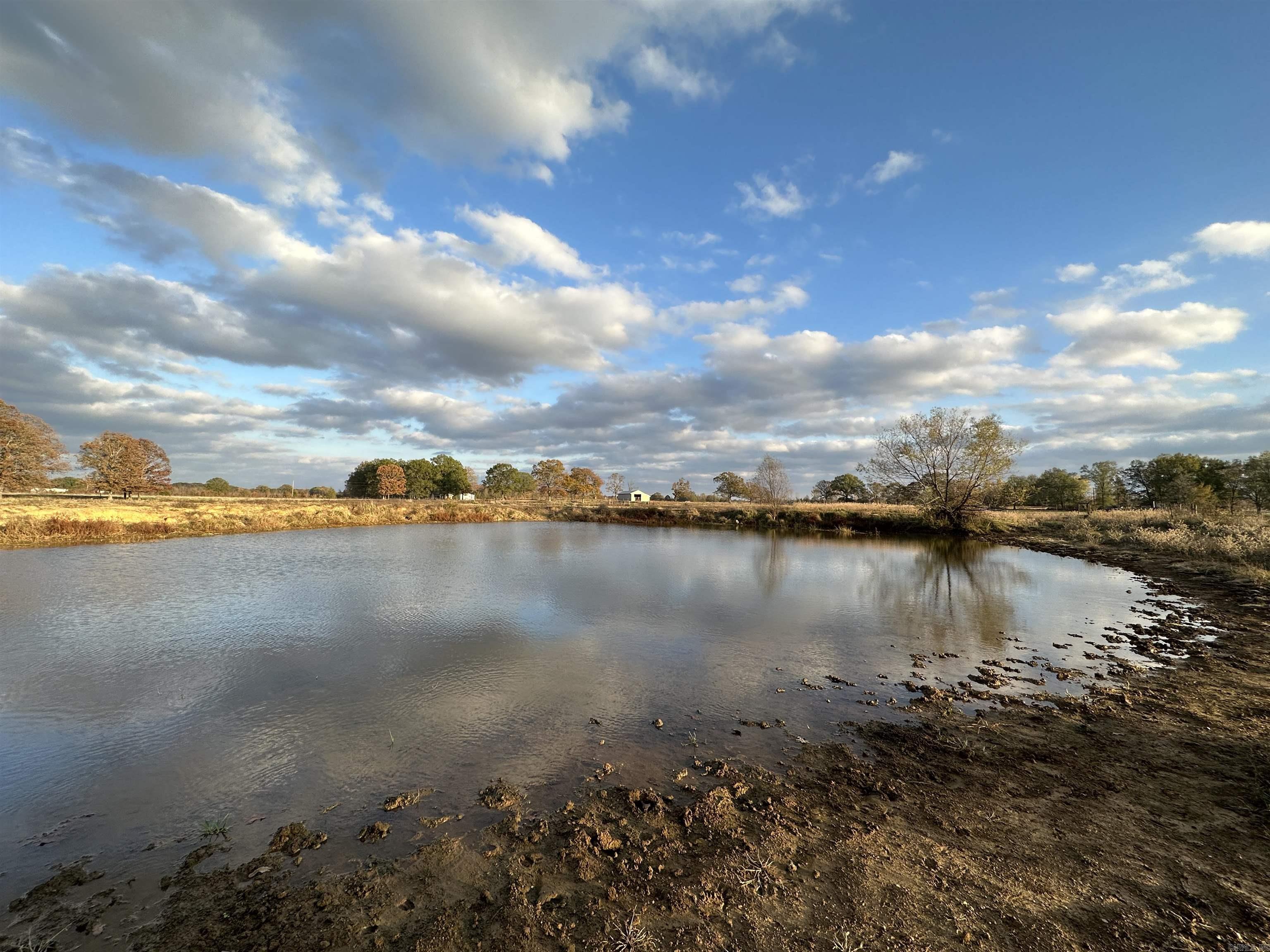 This 35+- acre property is perfect for someone looking to live in the country but having the amenities of and proximity to town. This property is in an outstanding location and would be well suited for a small farm with livestock, or for someone looking for a little more acreage. This property has a small pond and fencing on 3 sides. County water and electric are convenient to the property also. This property is less than 10 minutes from Beebe and less than 15 minutes from Cabot. Also, it's 10 minutes from Hwy. 67/167, and 3 minutes from Hwy. 5. (Additional acreage is available. Agent owned.) -9 miles to Beebe. -15 miles to Cabot. -20 miles to Conway. -25 miles to North Little Rock. -25 miles to Searcy.