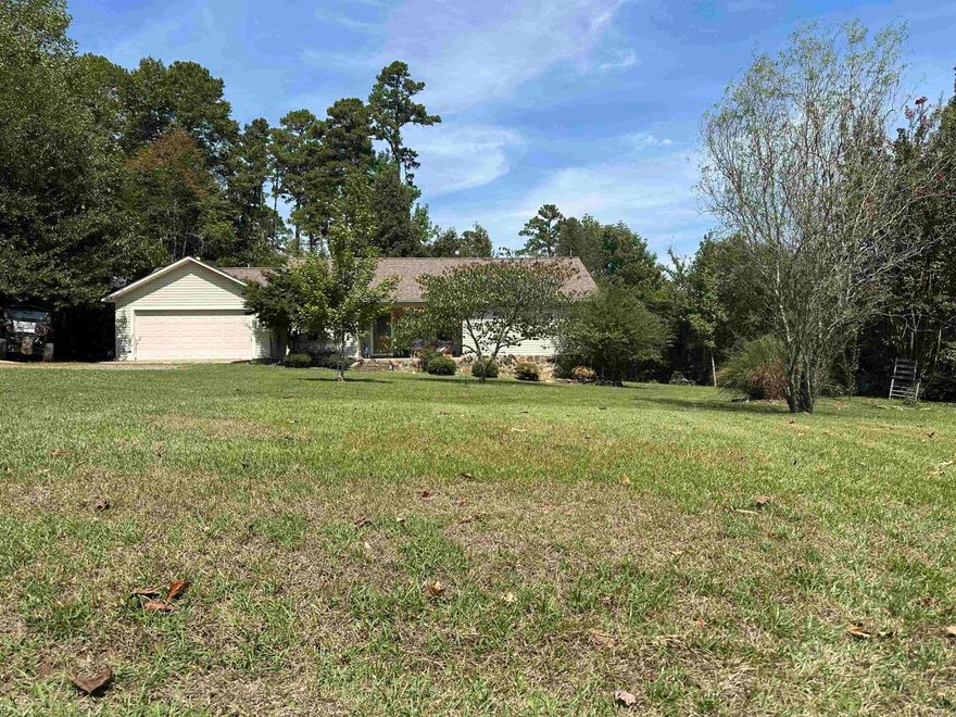 Looking for that home in a subdivision but gives you that country living feel, you just found it. This home is located in the beautiful subdivision of WoodHaven. This beauty has vaulted ceilings and crown molding throughout the home. Plenty of yard for those kiddos to play. Spacious kitchen and living room great for entertaining family and friends. You are centrally located just minutes from town or from any of the 3 boat launches. This won't last long so give us a call before it's to late.