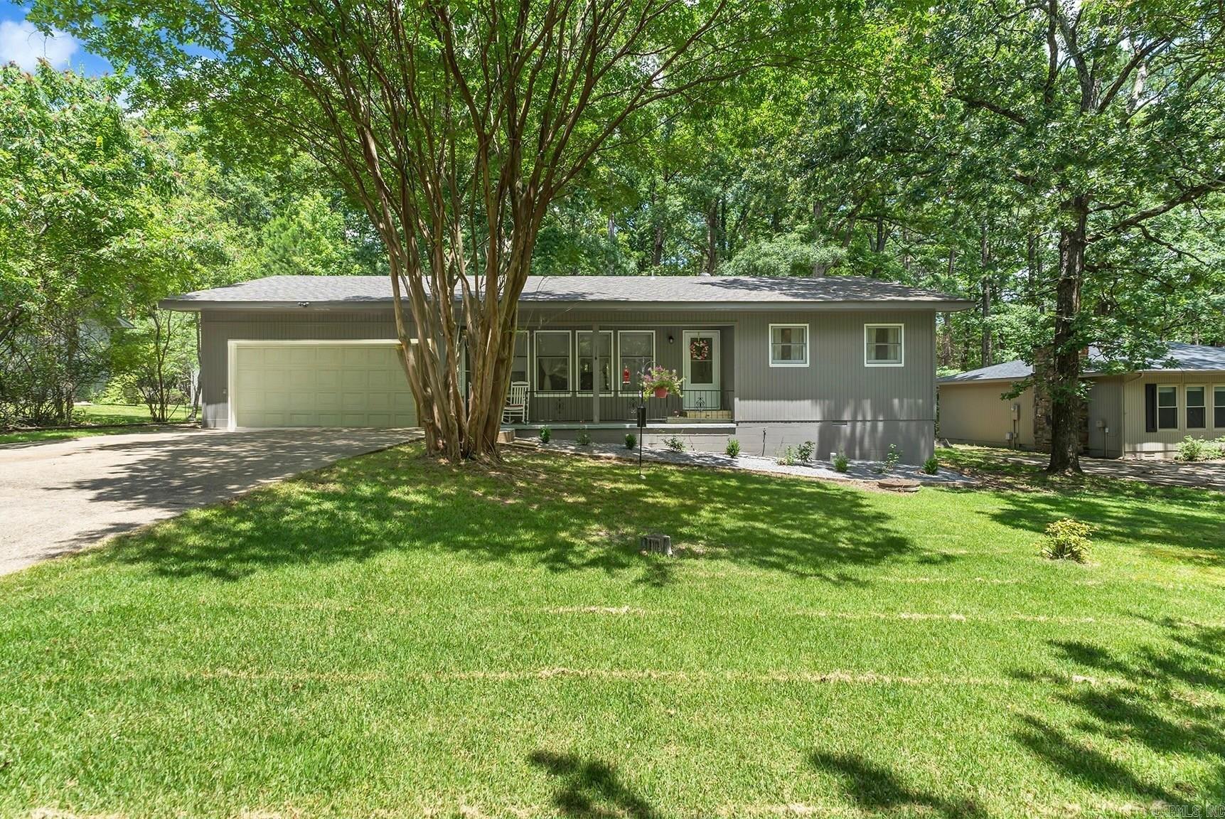 Welcome to this charming home featuring 2 bedrooms and two bathrooms. Step inside to luxury vinyl plank flooring and enjoy cooking in the stylish kitchen with sleek quartz countertops and newer appliances (Frig stays). The layout includes a bright living room, dedicated laundry room and a flexible sunroom that can serve as an office or extra space to suit your needs. The primary suite has its own private bath, while the second bedroom is served by a convenient hall bath. Outside, you'll find pretty landscaping in the front and fenced backyard. Relax on the welcoming front porch, unwind on the new back deck, and enjoy the security and space of the two-car garage with extra storage. This lovely home offers comfortable living in a picturesque setting - don't miss your chance to make it yours!