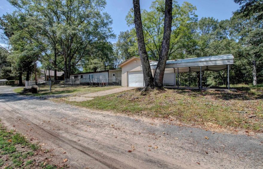 Lots of possibilities here! Beautiful country acreage at the Saline/Pulaski County Line. Mobile home sits on 1.25 acres...rare find in the part of the county. Mobile home is in need of some TLC or can have mobile home removed to build a new home. Fenced back yard! Come see!