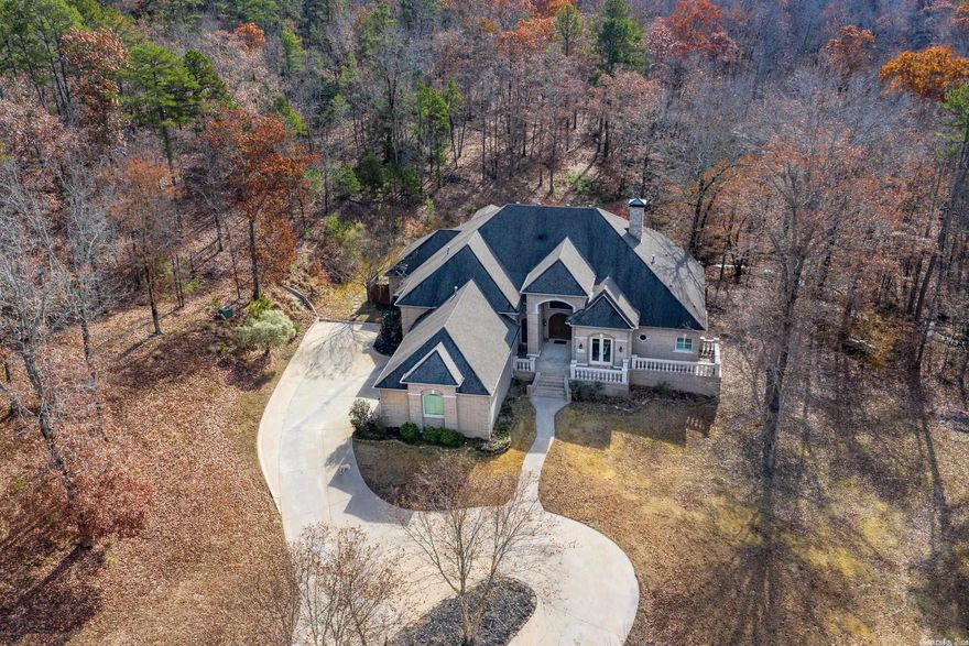 Welcome Home!This stunning completely updated home nestled on acreage is a must see!Large windows bring the outside in...The main living offers a dramatic office space with fireplace and patio, dining room, two living areas on main level, completely remodeled kitchen, all new hardwood flooring downstairs and all new bathrooms throughout the home!Upstairs find the large bonus room, office, exercise room, and craft room and an additional bedroom if needed.Don't miss the pool and outdoor space!It's a must SEE!