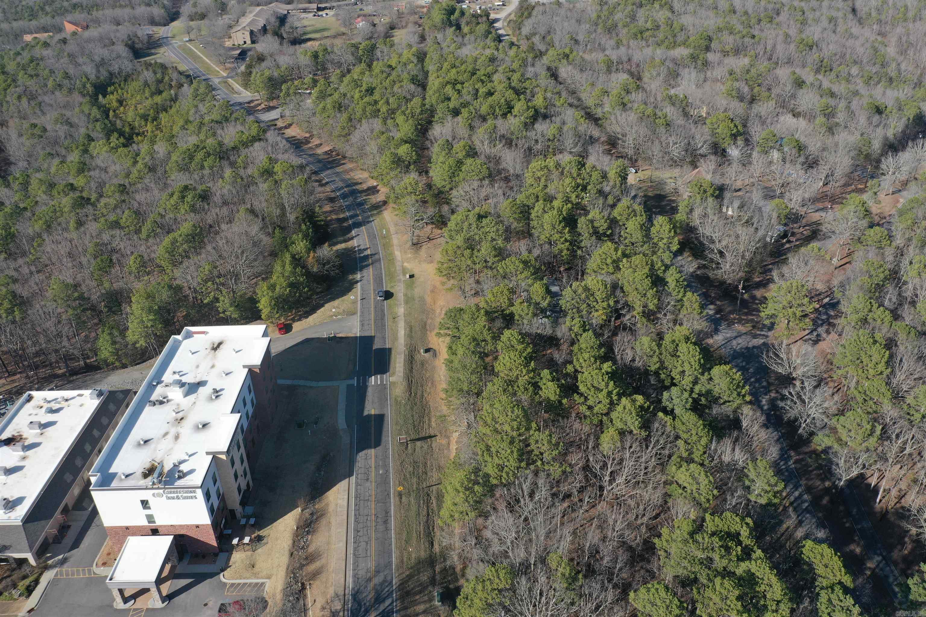 Welcome to market this vacant land zoned COMMERICAL right on Dave Creek Parkway. You can build your perfect business right in the heart of Fairfield Bay with main road frontage, good for boat storages, carwash, office building, Drive in movie, Property has utilities at street level. Is currently in 4 tracts that were divided then deeded as a whole and offered only as a whole. Buyer could then subdivide to make 4 commercial properties. Subdivision, development, or improvement of the property requires approval of the Planning and Zoning.