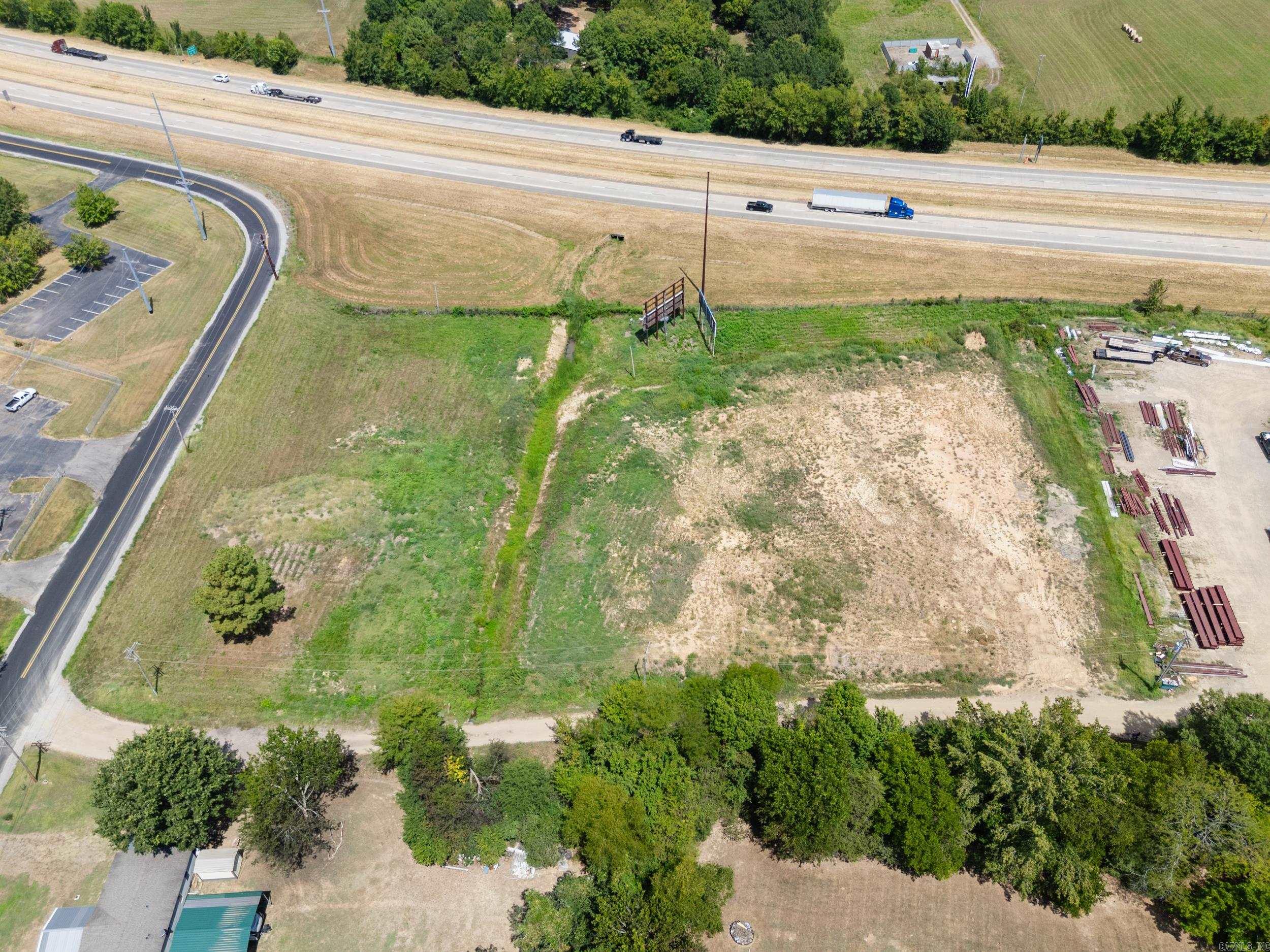Prime 4-Acre Industrial Lot with I-40 Frontage! Exceptional opportunity to own 4 acres currently zoned Industrial, offering maximum visibility and accessibility with direct frontage along I-40. Perfect for commercial or industrial development, this property provides excellent exposure with high traffic counts and convenient highway access. Additional acreage available for purchase at an additional cost, allowing flexibility for larger projects. A rare find with endless potential for investors, developers, or business owners.