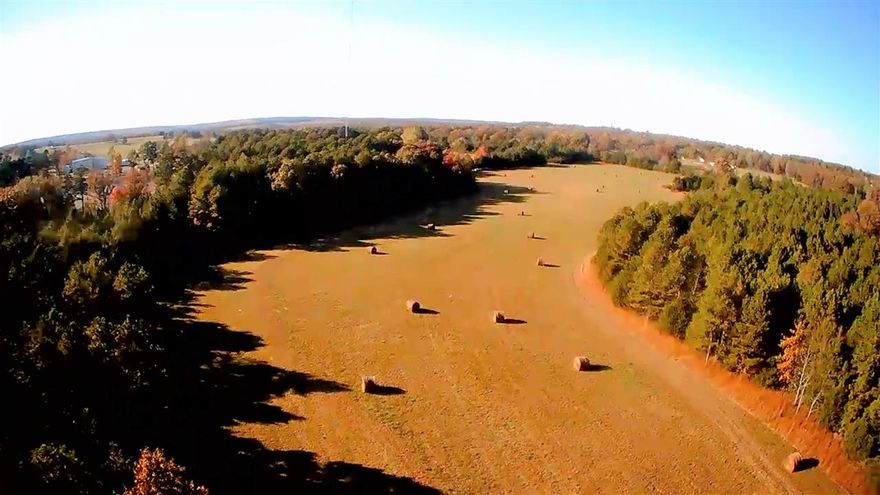 57 Incredible acres with gentle rolling pasture surrounded by timber. Field has been a great haymaker and has been limed almost every year, Timber is mixture of Mature Hardwoods (including white oak, while the softwoods are mature pines & cedars. Property features 2 ponds, 1 pond is spring fed, the other pond is a runoff collector but is deep. Deer and wildlife run rampant all over property and the fence is decent all the way around. Survey available upon request.