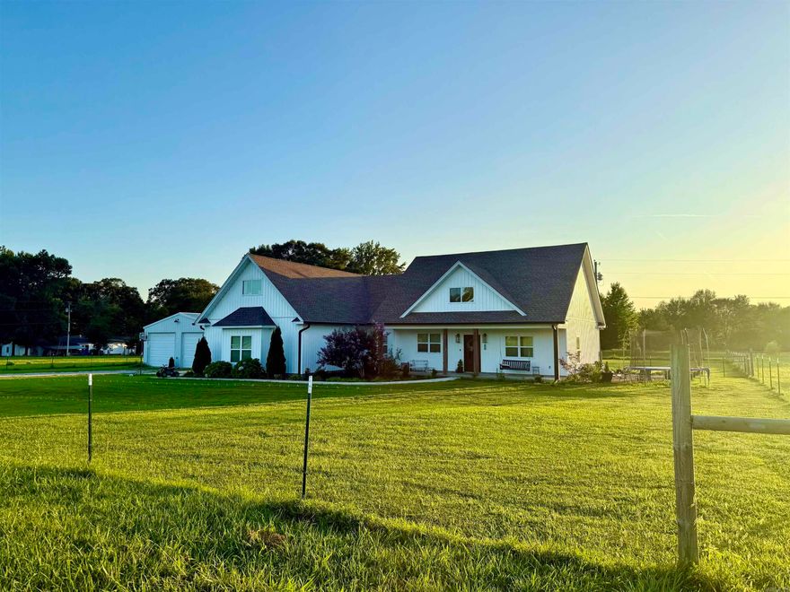 A rare opportunity to own a private, scenic property just minutes outside of Searcy. Built in 2022, this listing also offers a 30'x50' temperature controlled shop with it's own full bath & additional  bedroom. Just behind the shop are a 30'x40' barn & a picturesque 2 acre+/- pond. All this is nestled in a peaceful, country setting resting on 14.59 acres +/-. 3 bedroom, 2.5 bath home features a thoughtful layout with room for large common areas-making it great for hosting groups & friends. Beautiful stained concrete floors throughout the living areas & kitchen are nicely accented by soaring 14' ceilings in the den & dining room. It helps create an open, airy feel while the dedicated playroom upstairs adds flexibility for a growing household or bonus living space. The primary suite offers privacy & comfort. The ensuite's double sinks & oversized walk-in shower make this bathroom easy to love. Step out from the den onto the 350 sq.ft. +/- screened-in sun room. With a gas fireplace, this space is great for enjoyment year round!  Huge shop with 2 12'x12' doors and a 10'x10' door on the back. Even MORE storage in the 30'x40' barn located behind the shop.  Mineral rights convey.