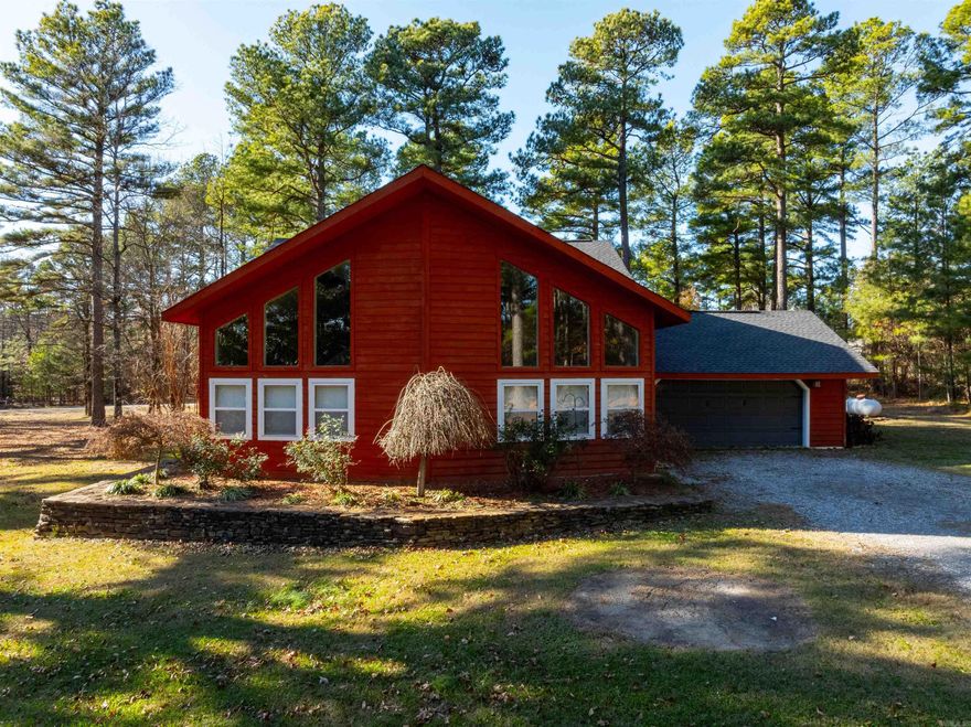 Charming Lodge-Style Home on 1.5 Acres in Desirable Southside! Nestled in a quiet neighborhood with no thru traffic, this home offers the perfect blend of privacy and convenience, just 1 mile off Highway 167. Despite its close proximity to town, the setting feels like a peaceful retreat deep in the country. This 1.5-story, 1,938 sq. ft. home features 3 bedrooms, 2 bathrooms, and a spacious living room with vaulted ceilings that flood the space with natural light. The mature pine tree-lined driveway, accented with large boulders, creates a grand and inviting entrance. Additional highlights include a double garage, a Bald Eagle barn, a storm cellar for peace of mind, a custom-built kids’ outdoor playset. The home is fully electric, with a heat pump, water heater, and stove, as well as propane backup heaters in both the home and garage—perfect for staying cozy on winter days. The property is equipped with a septic system, and the roof has been recently replaced for added peace of mind. Beautifully landscaped flower beds surround the home and accent the boulders at the driveway entrance. This is your chance to own a stunning, lodge-style property in a sought-after area.