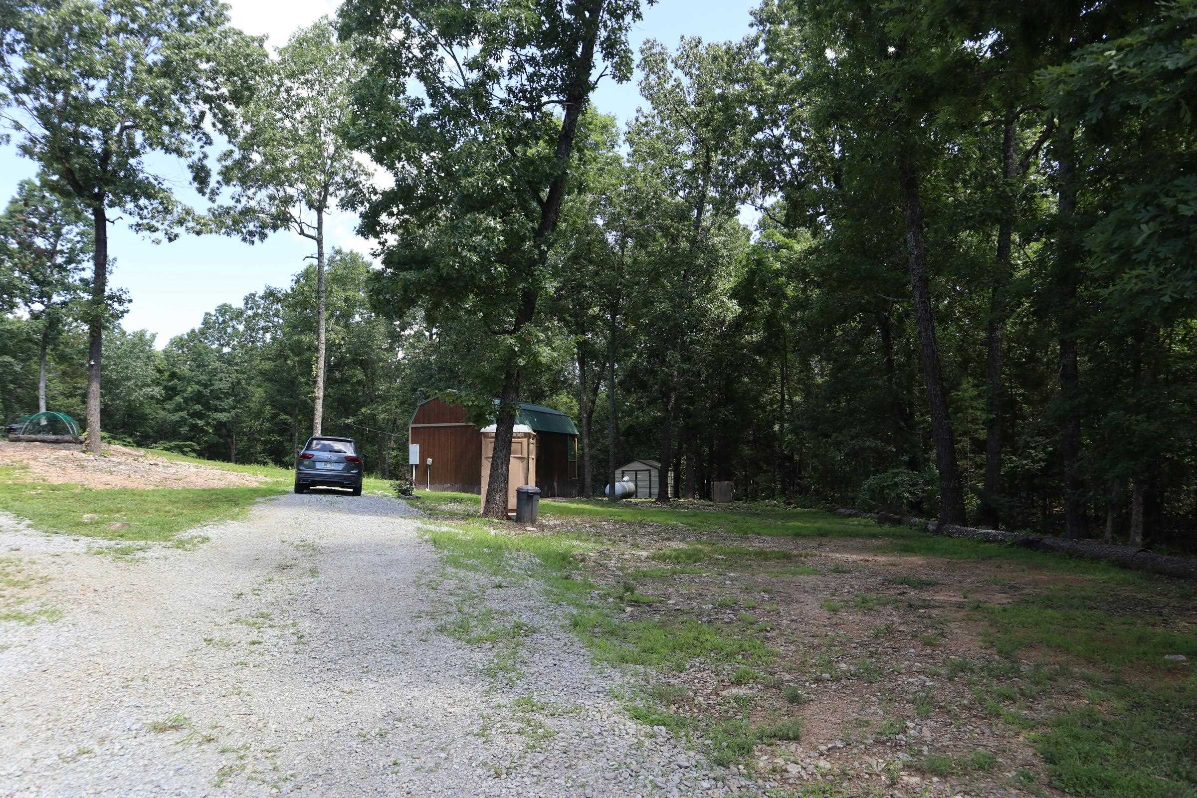 BUILDING SITE AND ACREAGE FOR SALE ELIZABETH ARKANSAS Property located at 1371 Handcove Rd., Elizabeth, AR. The property has a great location, approximately 1 1/2 miles off of US Hwy 62/412. No well or septic. Owner has had a percolation test for a 3 bedroom, 2 bath home. There is a leveled pad to construct a house or shop building. Most of the property is wooded with an abundance of wildlife. Lake Norfork access is just minutes away at Woods Point, Handcove and Henderson. Paved county road frontage. This Ozarks property is priced to sell. Bill of Assurance with restrictions.