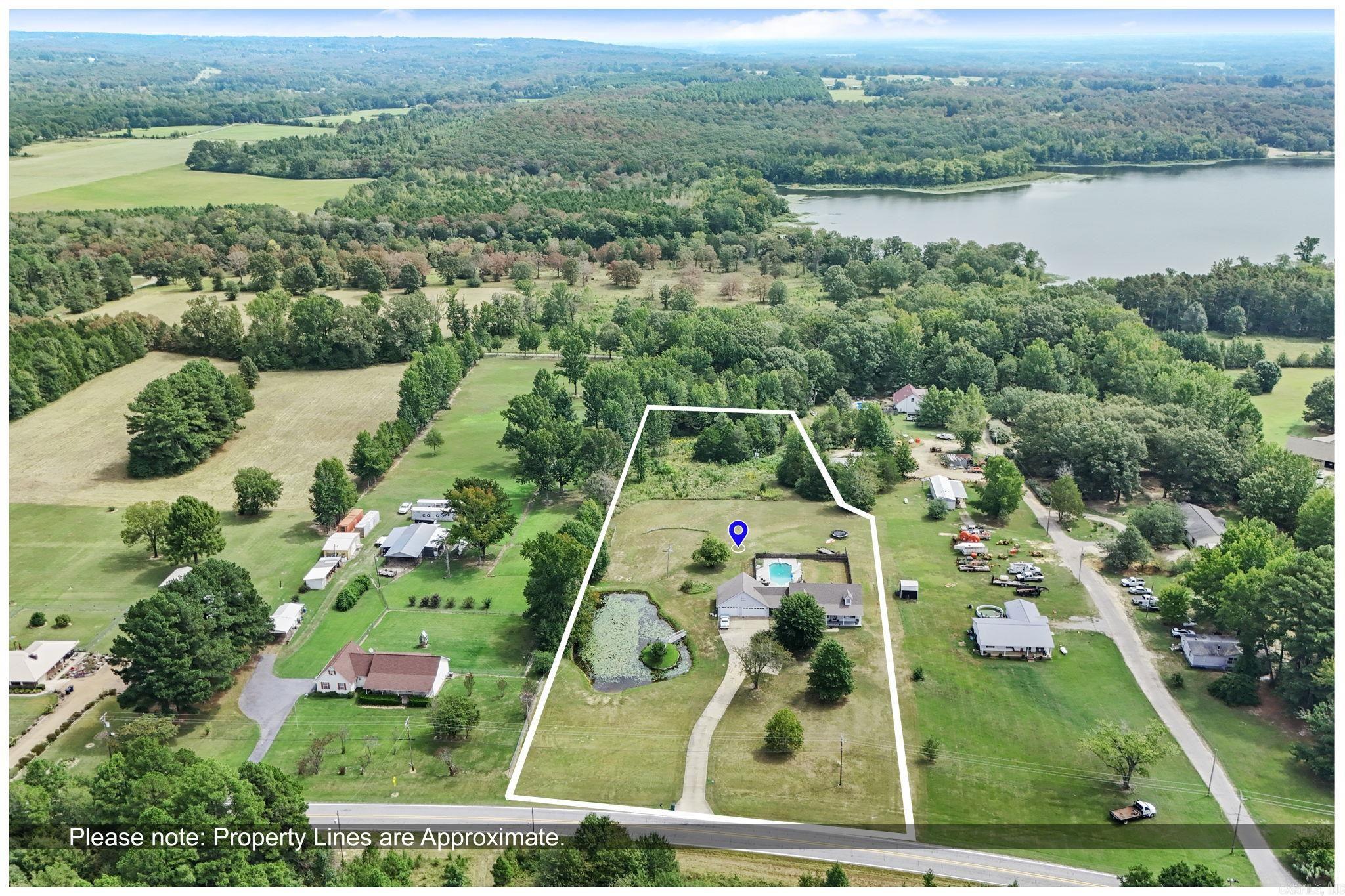 Beautiful 5BR/3.5BA home with 2 living areas or possible in-law quarters, 3 car garage, 3.57 acres, IN-GROUND Pool, & pond. Recently updated: paint, living quarters/apartment above garage, new Hvac units, roof, pool liner and diving board, security/camera system added, kitchen refresh: granite countertops, sink, faucet, appliances, flooring throughout, paint, bathrooms updated, light fixtures/fans & fireplace stone surround.
