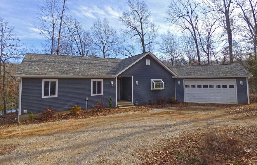 Beautiful One-Level Lakefront Home with Three Additional Lakefront Lots. This custom home was built in 2018 with 3 bedrooms, 2 full baths, vinyl plank flooring, large open living room with a gas log fireplace, custom kitchen with a gas stovetop and gorgeous cabinets. The master bedroom features views of Lake Aztec, master bath has a double vanity, soaking tub and walk-in shower. The big back deck is perfect for grilling or just relaxing and enjoying the peace and quiet of lake life. With 3 additional Lake Aztec lots you'll have plenty of room to entertain, room for the kids, of all ages, to play plus the lake frontage for fishing, swimming, paddle boards and kayaks. There's also a nice 2 car garage.