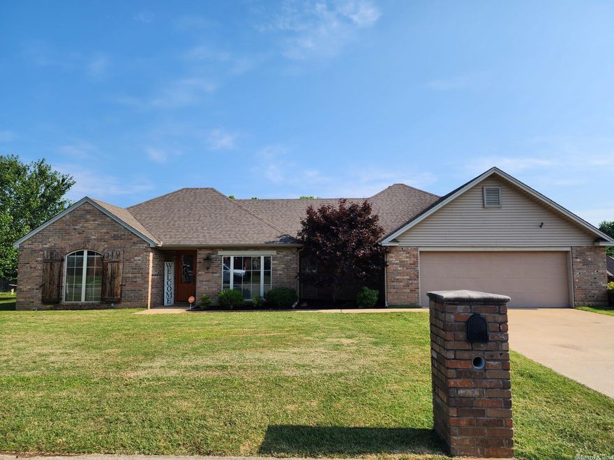 Custom built by Rhonda Landis with 2 car garage & gutters on a corner lot with yard sprinkler system, covered patio & privacy fenced in back yard. It features 3 bedrooms, 2 baths, scored & stained concrete floors except newer carpet in bedrooms, storm shelter in garage floor. Kitchen has stainless appliances, gas stove & custom vent-a-hood with granite countertops including island with breakfast bar, custom cabinets with pull outs & pantry. The living room has vaulted ceiling & a gas log fireplace. Separate dining with tray ceiling that could be used as an office. Main bedroom has tray ceiling & French doors to patio with attached bath that has jetted tub, separate shower with seat, double vanities, walk-in closet that also connects to separate laundry. New Train AC 3 years ago. Security system active, appointment only. See agent remarks!