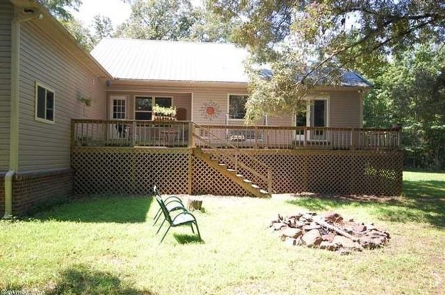 Awesome property. If you like country living, this is for you! Garden space, wildlife, and lots of blackberries. Enjoy sitting on the porch or large deck. over sized garage has a half bath and is attached with a breezeway. Nice hardwood floors, fireplace and custom hickory cabinets in kitchen.