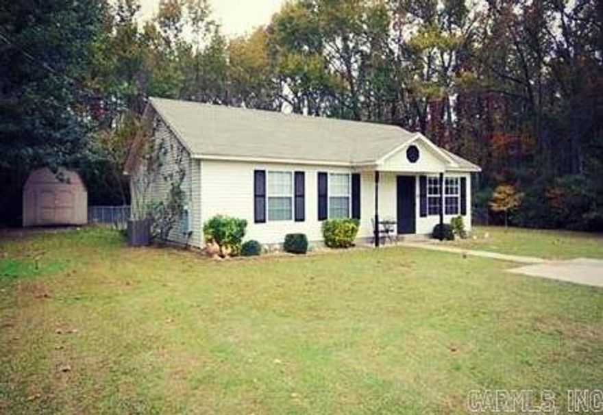 3 bed, 2 bath, open floor plan in a private country setting.  Mast. bedroom has tray ceiling, walk in closet and ceiling fan, kitchen offers stainless steel appliances, lots of storage space, new wood blinds, new door knobs, new a/c unit and new hot water heater. New carpet, hardwoods and tile. Living room has a vaulted ceiling and an open kitchen/dinning area. Lg. fenced back yard that backs up to woods.  A 10 X 12 storage building that conveys with property. Sq. Ft is approx., measuring is encouraged