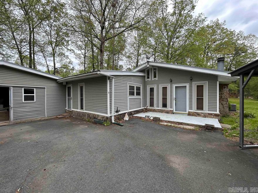 Nice 3 or 4 bedroom 2 bath home with lots to offer.  The home has beautiful exposed beam ceilings with several skylights.  It has a wood burning fireplace, several outbuildings, an established garden spot, lots of storage, fenced in areas for animals, and updated windows and doors. There is a well with a pump that allows you to water your garden or livestock without adding to the water bill.   With a 5 acre lot, this home feels like your in the country, but it is only a 3 minute drive to get to the heart of Clinton.  Located on a quiet street, this will be a great place for you to call home.