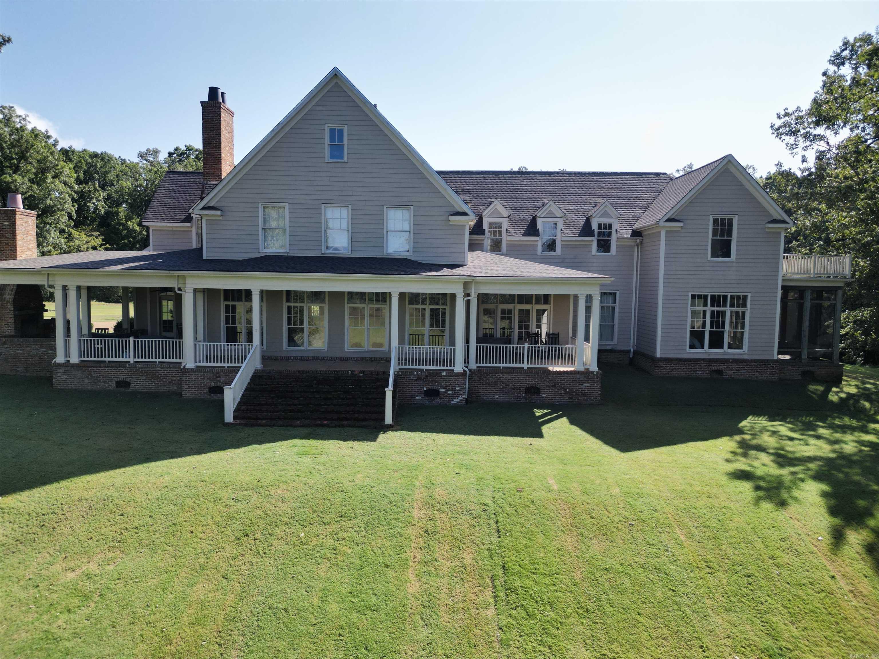 Located in Lexa, Phillips Co Arkansas, this beautiful 9500sf home sits on 13 +/- acres offering ultimate privacy on a beautiful landscape. This home offers 6500sf of living space including 5 bedrooms, 6 bathrooms and a massive laundry/mud room with endless amounts of storage space throughout the house. Upstairs you will find an additional living area or "mother-in-law quarters" that is approximately 1200sf with its own bathroom and heat and air. There were no corners cut on the design of this house. There are beautiful pine wood floors mixed in with flagstone floors as you walk in through the front door. The kitchen hosts a large island area with a built-in banquette style seating area. The master bedroom has massive separate his and hers closet space. Outside of the house you will find porches all around the home, an outdoor fireplace along with neat features such as a private screened in area connected to the master bedroom. The roof has been replaced as of 2022. In addition, one of the A/C units is new as of 2019 and one is new as of 2023.