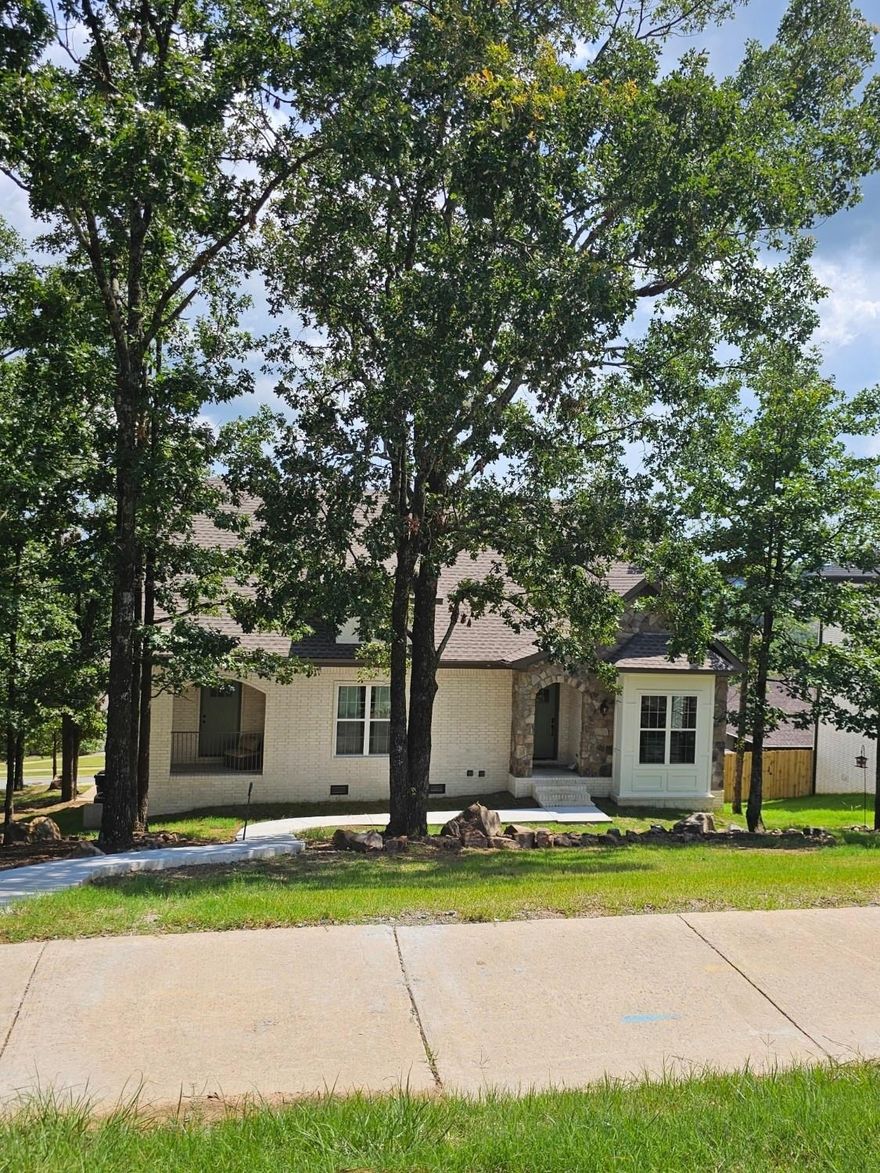 13 Basswood Terrace has a view with all the additions for entertaining. The .4 acre lot extends from Basswood Terrace to Scenic Ridge Drive so you will never have a home behind you.  The main level has a master bedroom, bath, and walk in closet that has a modern feel with lots of space. The living area is open and large with lots of room for family time.  There is an office or third bedroom on the main level.  Beautiful kitchen with tons of storage, walk in pantry and beautiful countertops in the kitchen.  Laundry room on the main level. The home is 2 stories with a separate kitchenette/living space in the walk out basement.  It could be the ultimate man cave! There is also a full bath and bedroom downstairs with washer / dryer hookups.  Two car garage.  Covered porches, one has a hot tub!!