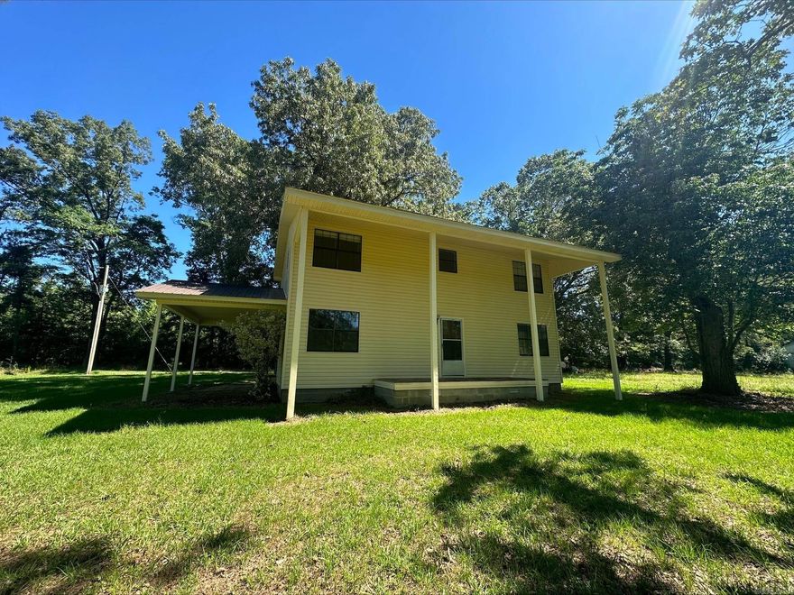 Want to HOMESTEAD?! Then take a look at this home that sits in solitude on a quiet lane on Rock Springs Rd! From your front porch you can view these beautiful mature trees as the home sits beautifully on the back of the land and you have the entire front and side spanning acreage to do as you please, garden, have cattle or horses, farm living at it's finest, is to be had here. A footprint is there for 4 chicken houses (once used but not currently operational)  along with 2 large farm equipment pole barns, providing plenty of room for tractors, farm equipment, ATVS, boats etc. The home is on rural water, but does have a well on site (currently not in use) which was once used to provide water for the chicken houses.  All this, with Lake Monticello is just a few miles down the road!