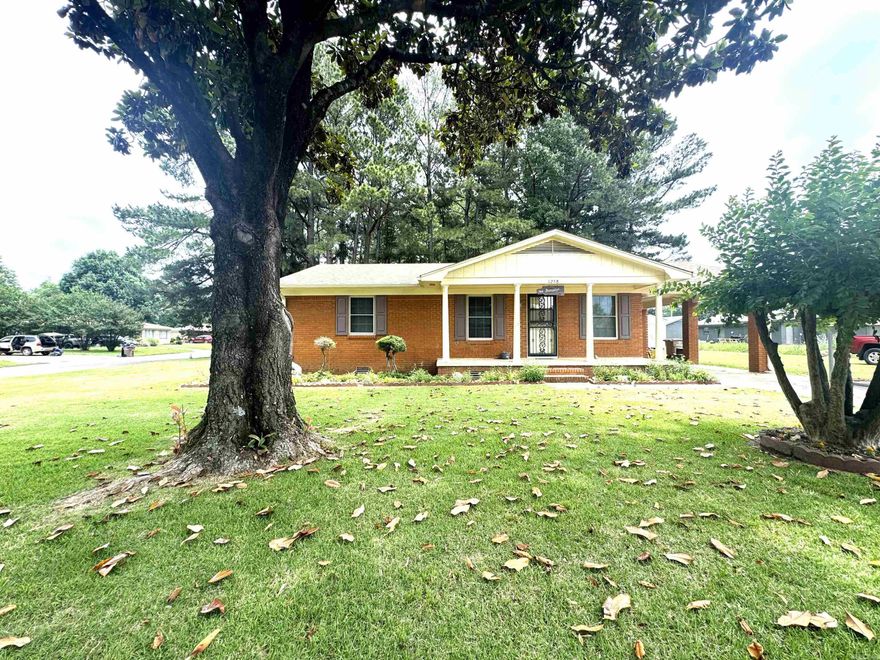 This charming 4 bedroom, 2 bath brick home situated on a desirable corner lot is well maintained and offers a spacious layout with durable LVP throughout most of the home.  The large primary suite is privately located at the back of the house and features a walk-in closet, ensuite bath with shower, and convenient washer and dryer connections.  The home includes 3 linen closets, providing excellent storage space, along with 2 outdoor storage sheds for tools. lawn equipment, or hobbies.  The hall bath features a tile floor and tub/shower combination.  An additional update includes a roof that is 5 years old.  With its functional floor plan, ample storage and attractive brick exterior, this home is ready for its next owner.
