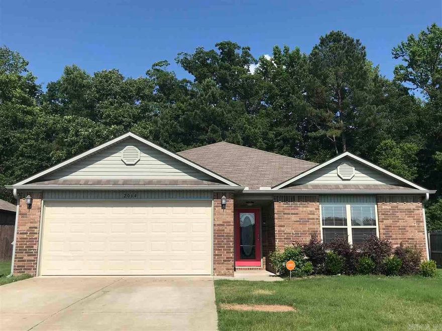 Move in ready! 3 Bed/2 Bath minutes from I-30, shopping, dining, and Bryant Schools! Large living room open to the kitchen, walk in closet in master, fenced in back yard with a covered patio with green space behind you!