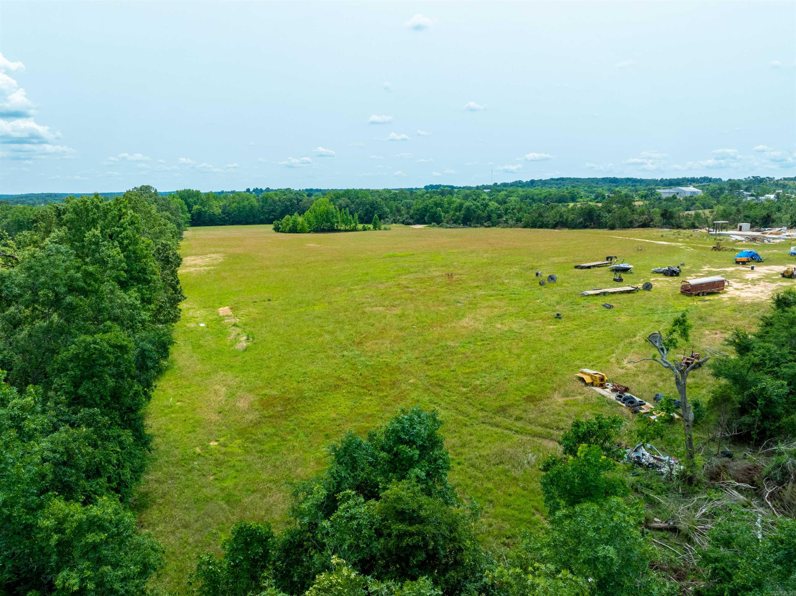 One of the largest remaining tracts of land in Cave City is now available and ready for new ownership. Offering endless opportunities, this property features road access from both North Street and Meadow Street, located right in the heart of town. Utilities are available at the property, making it an ideal site for development. A home and shop once stood here but have since been removed, leaving behind gentle rolling hills, open fields, and a large pond. This rare piece of land is full of potential and would make an exceptional investment. Don’t miss the chance to own this special property.