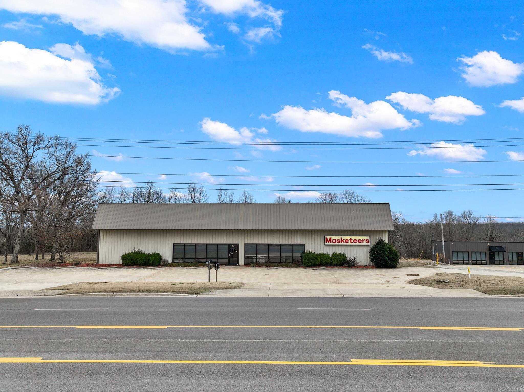 Prime commercial opportunity! This 5,000 sq. ft. building on 0.59 acres boasts highway frontage with 10,000 ADT, ensuring maximum visibility. Designed for construction, manufacturing, or inventory storage, it features two large bay doors for seamless semi deliveries. Inside, youāll find finished epoxy floors, a showroom, a high-end office, and a conference room. Amenities include two kitchenettes, a break room, a full public bathroom, and a private half bath. Security is top-notch with high-end surveillance inside and out. Previously a medical-grade manufacturing facility, it meets A-grade compliance standards. With ample parking in the front and back, this property is move-in ready for your next business venture!