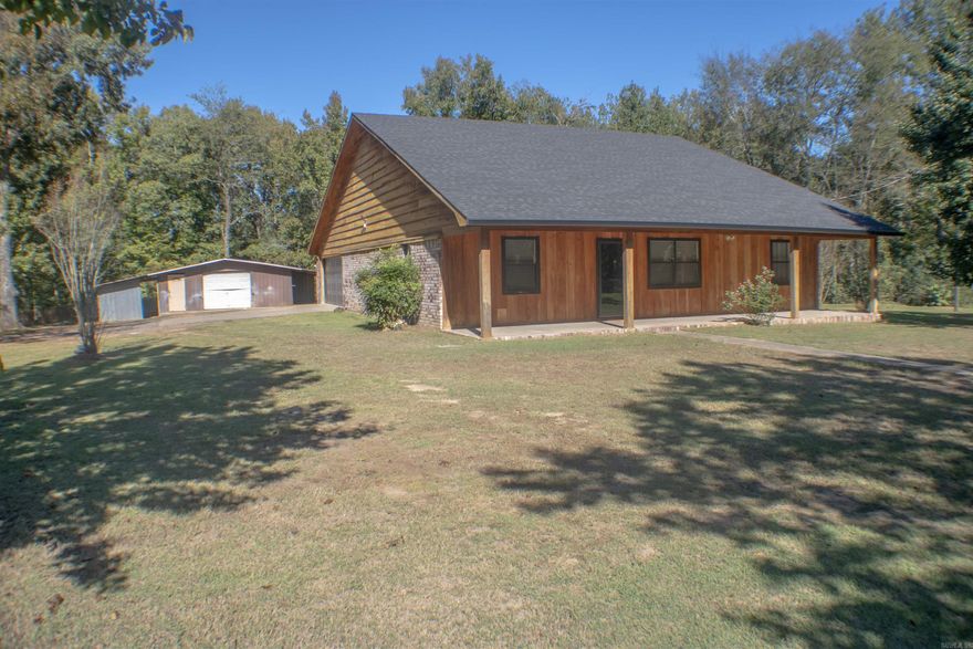 Discover your own private retreat nestled among the trees, where rustic charm meets modern comfort. The open-concept layout unites the living room, kitchen, and dining area, creating the ideal space for hosting family and friends.  Agent's please see remarks.