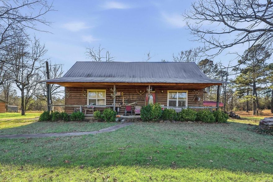 One of a kind hunting property set up and ready to use. This 6 acre tract offers a private deer camp with multiple cabins, outbuildings, and utilities already in place. Whether you are looking for a weekend hunting retreat, a place to gather with family during deer season, or a base camp for outdoor recreation, this property is ready to go. The main log-style cabin features a spacious open living area with soaring wood ceilings and a rustic lodge feel that perfectly fits the setting. Additional cabins and outbuildings on the property provide extra sleeping space, storage for hunting gear, and room for guests during hunting season. A well and electricity are already in place, giving the property the essentials needed for comfortable stays at camp. Surrounded by woods and wildlife habitat, the land offers excellent deer hunting opportunities and the privacy that hunters are looking for. The layout of the property makes it easy to spread out stands, maintain feeders, and enjoy the outdoors. This property is being marketed as recreational land and hunting camp use only, as there is currently no septic system installed. A road permit form Weyerhaeuser provides access to the property.