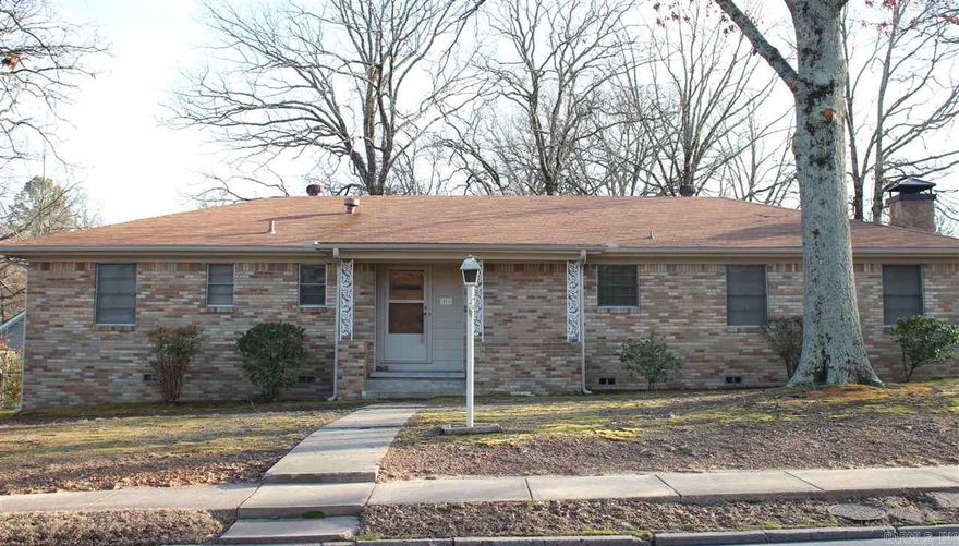 Great family home in the heart of Sherwood. This all brick house has 2 living spaces, 3 bdrms, 2ba. Located on a great corner lot w/driveway on the side street for easy in & out. House features hardwood flooring in bedrooms, hall& living room. Kitchen features a new wall oven, wood cabinets and is open to hearth room w/wood burning fire place. Frig., washer & dryer stay. New furnace & hwh in 2014, gutters 2010, roof & siding 2009. 2 car carport w/storage attached. Large fenced yard w/double gate & storage.