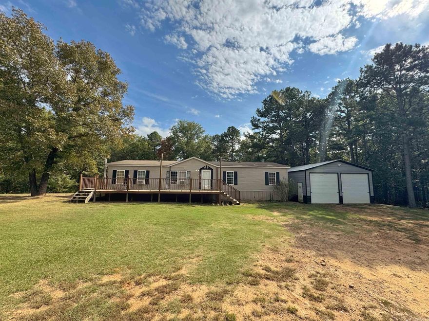 At the end of a quiet dead-end road in the Dardanelle School District, this home sits on a full acre of flat, usable land with room to breathe. A major bonus is the large metal shop, just under 900 sq ft. with rolling bay doors, ideal for storage, hobbies, or home business needs. The home offers an open concept layout with split bedrooms and space to update to your taste, and the yard has plenty of room for pets, play, or parking. Minutes to in-town conveniences yet tucked out of traffic, this spot hits the sweet spot for privacy and practicality. Sellers are very motivated and offering a $10,000 allowance for your buyer to apply toward closing costs or upgrades; instant equity opportunity for someone ready to make it theirs. A rare combination of acreage, shop space, and end of road setting at an attainable price point in the River Valley.