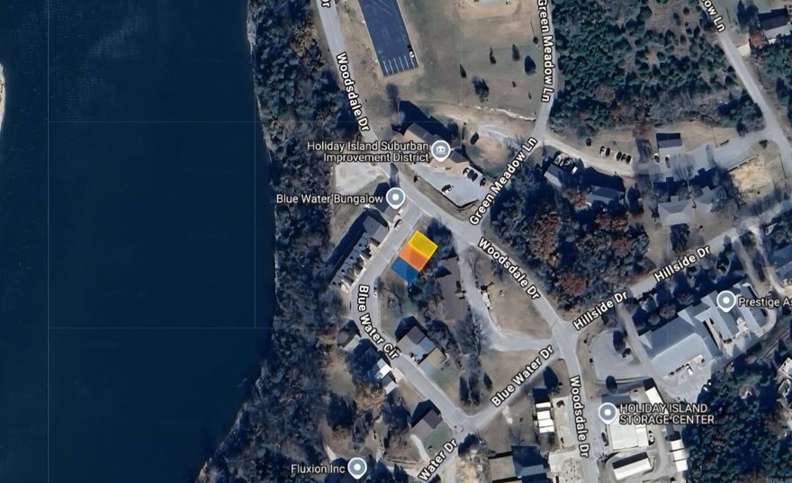 Build your business on this .10 (+/-) acre lot (3 parcels) in Holiday Island that is by the water and Holiday Island Marina!! It is close to local amenities and Eureka Springs as well. Property conveys a Limited Warranty Deed. Owner financing available. Call or text for more information.