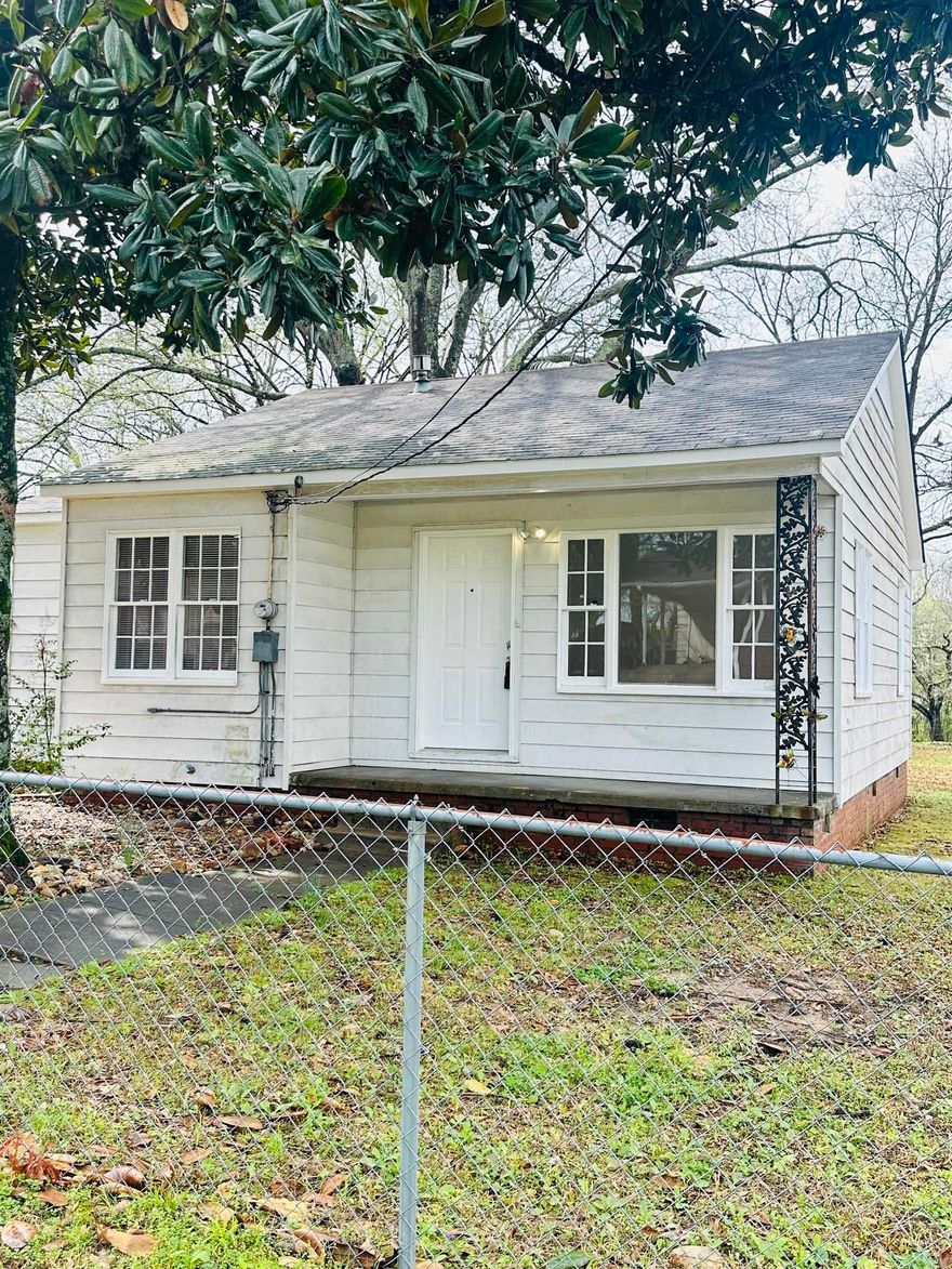 Small and mighty! Adorable 2bed/1bath that feels like a traditional southern home with a mature magnolia tree in the front yard. This home has a great floor plan with a living room, eat-in kitchen, two nice sized bedrooms and a bathroom with a tiled tub/shower combination. Stay dry in rainy weather with access from your covered carport directly into the eat-in kitchen...so convenient! The washer/dryer hookups are inside the house as well.  The new HVAC will keep you cool in the summer and warm in the winter. Lots of amenities in a small space. The backyard is a great size and has a shop with a concrete floor that can store all your extras. A don't miss property! **agents-see remarks**