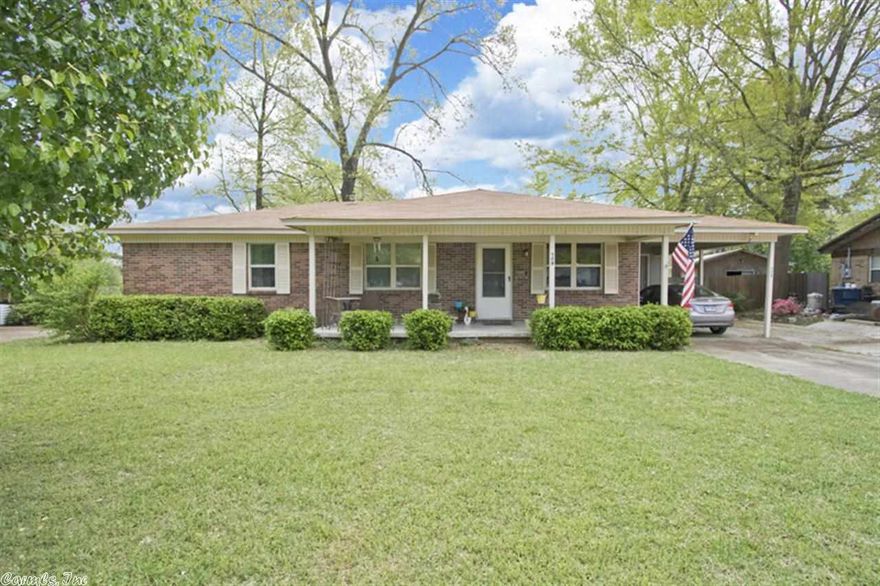 Great 3 bd 2 ba home in quiet neighborhood.  2 living areas.  Living room with built-ins open to newly remodeled kitchen and dining area.  New cabinets/counter tops, island with breakfast bar and electricity, laminate flooring, breakfast nook. Den w/ wood burning fp & hardwood flooring. 2 level deck to back yard. Xtra large outside storage with concrete parking pad with curb behind storage building. Extra parking pad in front. Move in ready.Curtains do not convey. Do not go into back yard with dogs present