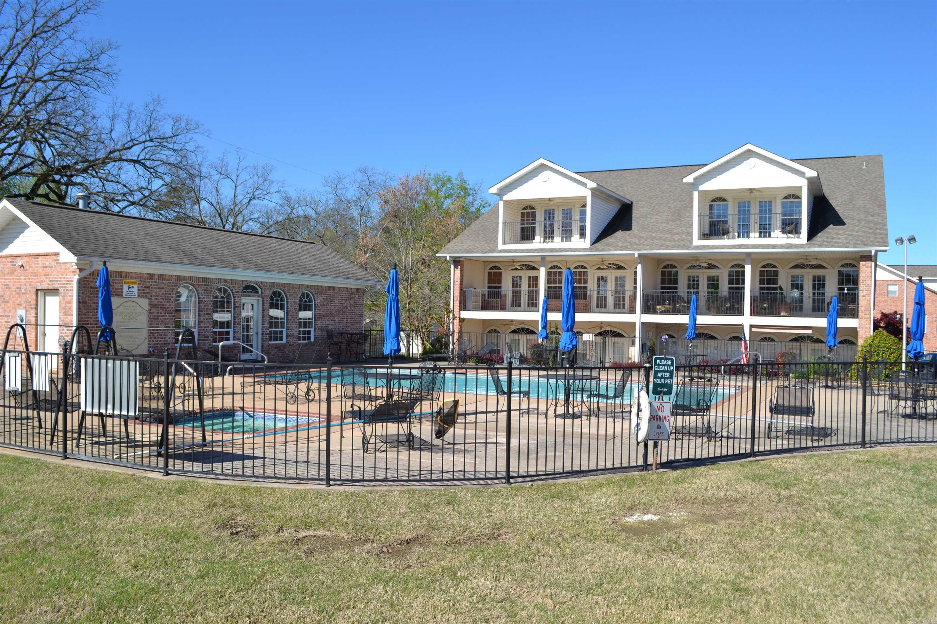 $6700 assessment due this coming January has been paid in full by seller!!! This is living the life in one of Hot Springs most prestigious gated condominium communities right off Central avenue in the heart of town. Accompanied with the feeling that you have your very own private pool and hot tub right out your back door.   This 3000+ 3 bedroom/3 bath condo with office and game room spaces offers comfortable sleeping accommodations for 10 with 2 master suites.    Unit is being sold fully furnished with all furniture, linens, plates, pots/pans, silverware, TV's. There are a few items clearly marked that do not convey but they are very few.   This unit does not have a boat slip!!
