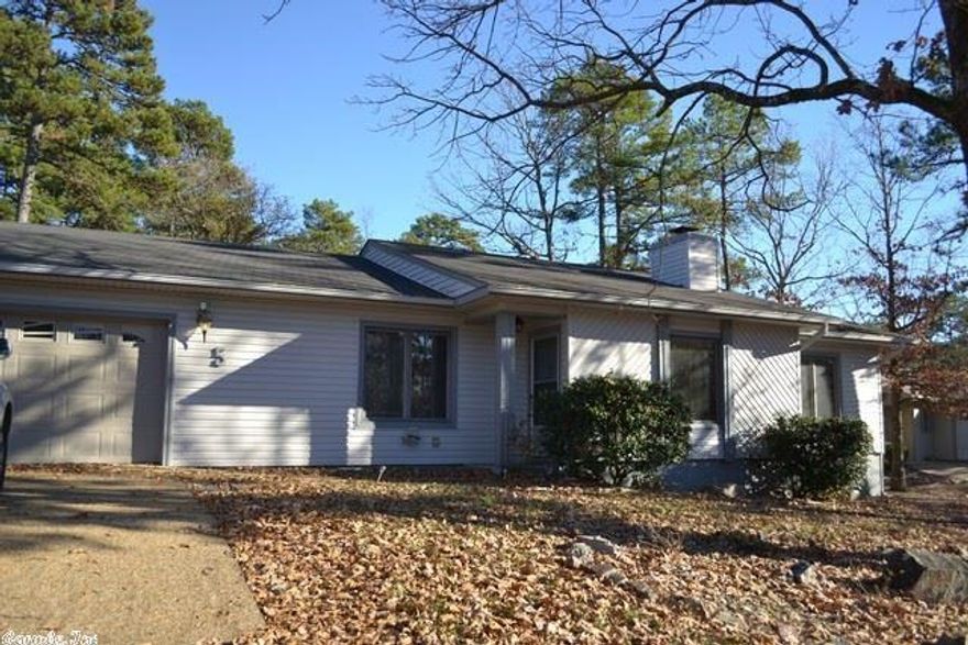 Conveniently located at the front of the village.  Three bedroom, 2 baths on one level.  Lot has slight up slope for driveway, then levels out for home and back yard area.  All home vac, fireplace with insert.  Wonderful screened porch overlooks wooded common property.  Extra room off the laundry room for office, hobby room or 4th bedroom with an armoire.  Carpet, laminate & tile flooring.  Two car garage with pull down stairs to access storage area above. $2,500 decorating allowance for Buyer.