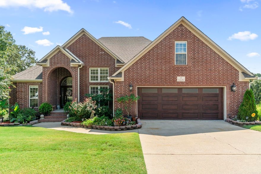 PRICE REDUCED!! Sit back and relax while enjoying the amazing views of the water from your back covered deck.  This home has 4 bedrooms, 3 baths and a bonus/theatre room. Additional Features include: Open foyer leading to a living room with high ceilings, custom crown molding, plantation shutters and a gas-log fireplace with switch start; formal dining; kitchen with all new SS Frigidaire Pro & Gallery appliances, granite counters, backsplash, pull out cabinet shelves and breakfast nook.  Central vacuum, new carpet upstairs, Quartz counter tops in bathrooms, extra decking in attic for storage, tray ceilings, walk-in shower, breakfast bar and insulated doors/windows. Covered double patio overlooking the lake, with a private dock for private lake access, fishing or paddleboating. Lower deck is wired with 220 amp for installation of a hot tub or spa. New Safe Step Walk-in Tub was added 3 months ago with all the features...lights, sound, bubbles and massage $22,000 upgrade.  Tons of stone, shale, top soil and sod have been added to raise the backyard up 3 feet and sprinkler system installed. See docs for additional information.  Call today to schedule your showing on this property!!