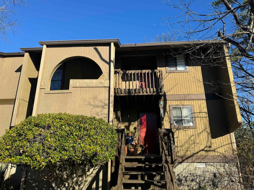 In West Little Rock, discover this exquisite 2 bedroom, 2 bath condo! Luxurious vinyl flooring graces the space, while the kitchen boasts stunning new counters and cabinetry. Enjoy gorgeous views of the community pool from the living area and primary suite, accessible through sliding doors that lead to a covered balcony. The spacious living room, featuring a wood-burning fireplace, seamlessly adjoins the dining and kitchen areas. Upgraded primary bathroom.  Ample storage is provided by the large closets and two additional linen closets. Step out from the living area onto another covered balcony through a third sliding glass door, with an outdoor storage closet.