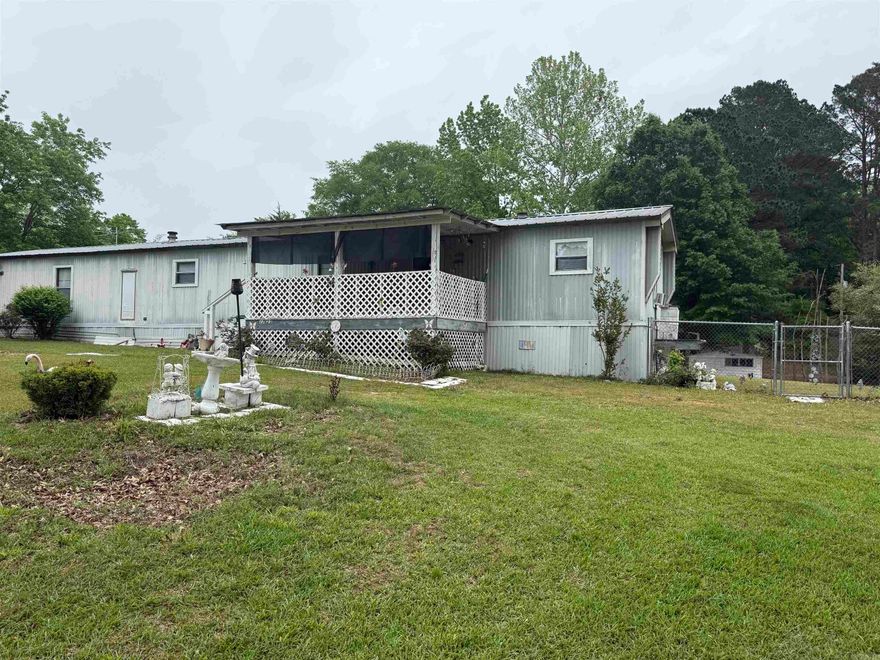 Opportunity awaits with this 2 bed, 2 bath mobile home on a beautiful near acre tract. The fully fenced property includes a storm shelter for peace of mind and multiple out buildings fro extra storage or hobbies. This property is nestled just 10 minutes from the Air Force Base and convenient to shopping.   This property is ideal for those looking for space, functionality, and country charm.