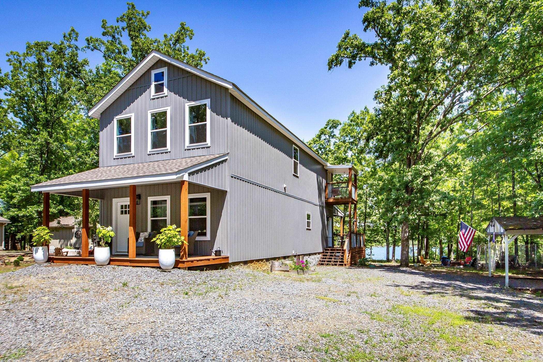 4 Bedroom / 2.5 Bath Lakefront Home just a golf cart ride away from Lacey's Marina & a short drive to Narrows Boat Launch. Main Floor has Master Suite w/walk-in shower, plus 1/2 bath off of the kitchen area. Upstairs has a second entertainment space w/three more bedrooms & full bath w/covered balcony overlooking the lake. Located on "The Narrows" part of Greers Ferry Lake w/an easy walk to the water & lake view. Buyers have option for additional $25,000 to purchase home furnished with all appliances, furnishings, game room items, tv's, & dish-ware (minus Sellers pictures, clothing, & a few other personal items). There is a cozy covered front porch & back porch is covered as well for entertaining guest in the shade. See survey online under "docs"