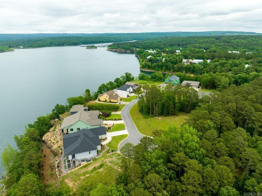 Vacant level lot in the gated and very private Wisdom Pointe Subdivision!  This lot views Greers Ferry Lake in several directions and is absolutely ready to build on!  Located just 5 minutes from a boat slip at Dam Site Marina!  The perfect spot for retirement or a vacation home!