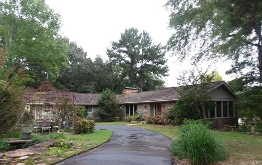 Rare find on Beaverfork Lake. Large home right on the lake with breath taking views. Home offers large room and a huge deck that has a screened area. Full walk out basement. Must see to appreciate all this wonderful property has to offer. Boat house with a lift, large dock and covered gazebo offer the oppprtunity to enjoy evening watching the sun set. Seperate shop, all on 7.45 breath taking acres.  Home sold as is. No property disclosure is available