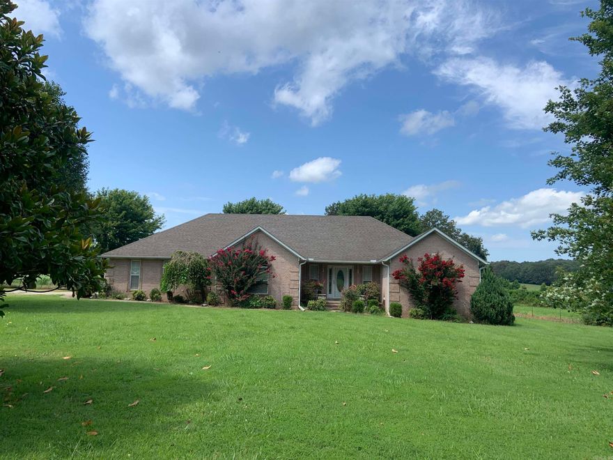 Very nice all brick, 3 br, 2.5 ba sitting on 4.36 Acres  Cherry kitchen cabinets, Greatroom w/gas log fireplace.  Stainless appl. Nice primary suite. separate storage bldg.