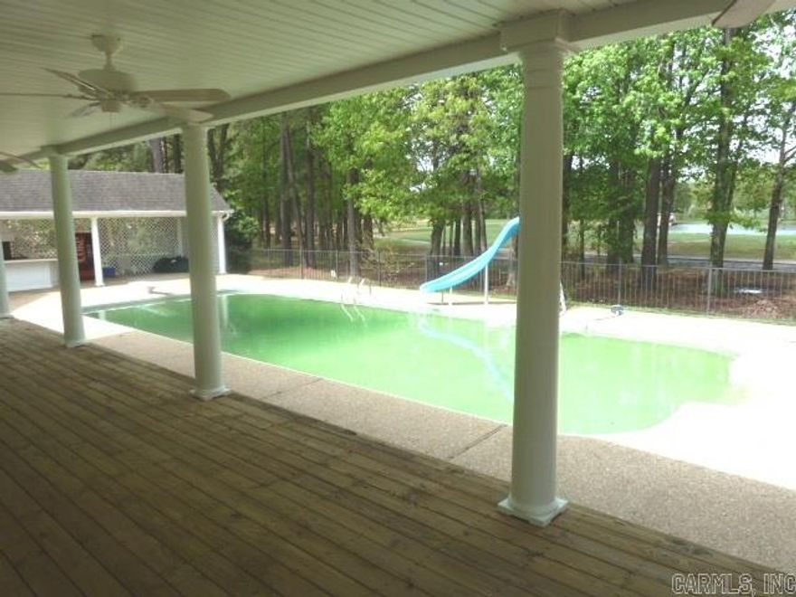 This gorgeous home has updates galore!  Large kitchen w/new granite countertops, cooktop & faucet.  All new paint & carpet.  All bedrooms have private baths.  New tile and granite countertops in laundry. Formal living & dining plus den. Office has brick floor & outside entrance.  4th bedroom sep from others.  Huge game room on main level w/bar.  Outside paradise with large in ground pool, covered patio, outside shower, cabana w/bar & built in grill & view of golf course and lake. Too much to list. NICE!!