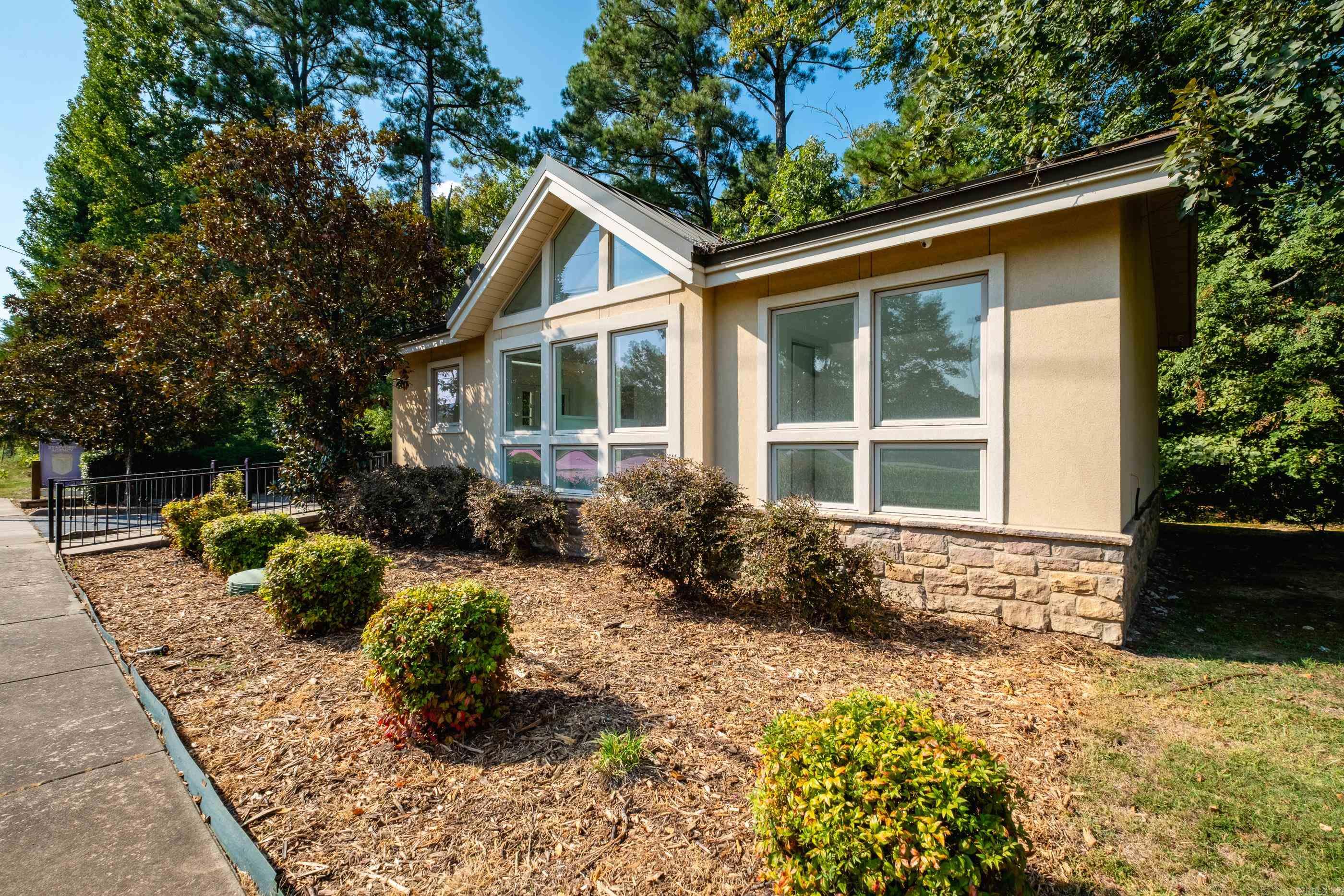 Rare opportunity in the heart of West Little Rock! This charming small office building offers approximately 750 sq. ft. on a .21-acre lot, surrounded by thriving office, retail, and dining establishments. With prominent signage visible from Cantrell Road, the property combines excellent exposure with a unique setting—complete with creek views that create a peaceful, almost rural feel. Inside, you’ll find two private offices, an open area for flexible office use, a restroom, and a break space with mini fridge, microwave, and sink. Zoned POD (General Professional Office), this is an ideal space for professionals seeking a highly convenient yet tranquil location. Truly a rare find in this sought-after corridor! See agent remarks.
