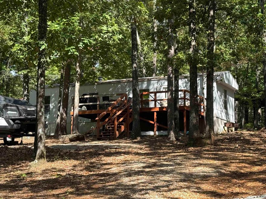 Take a look at this super cute home just across the road from Greers Ferry Lake! Located in the quiet community of Marvinsville you will have all the privacy you could want. Enjoy sitting out on your front deck watching all the wildlife with no traffic and a partial winter lake view. Home has been updated with new flooring, fresh paint, and new gas oven/cookstove. Nice circle drive with plenty of parking, new storage building and small carport to store your lake toys or ATV. Give us a call today!