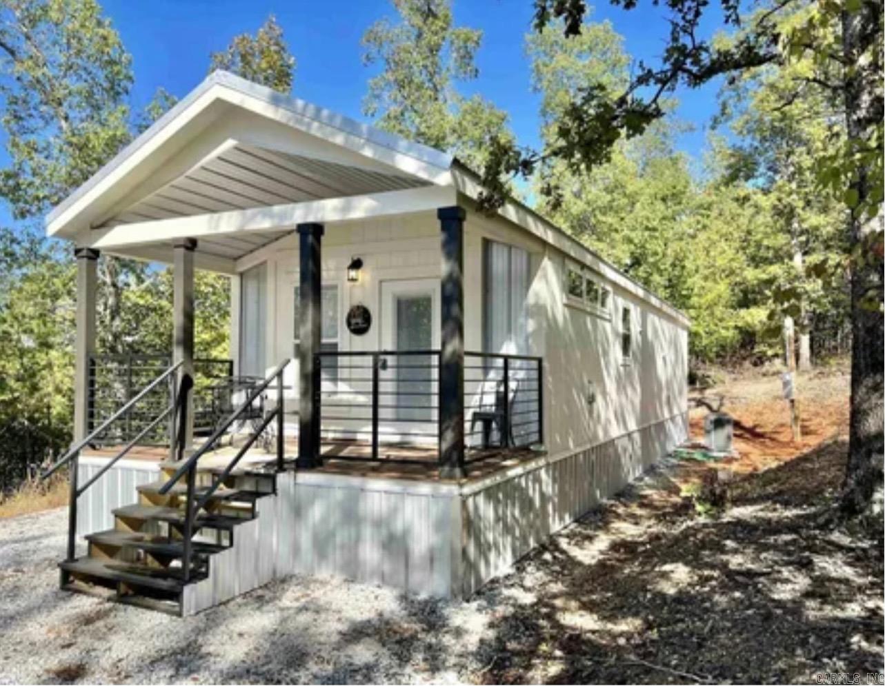 Tiny home, nestled in the woods of beautiful Mountain View AR, this 863 sqft would make ideal getaway home, weekend retreat, nightly rental or first home. Comes completely furnished and has a pad out back to build shop on or put RV for guests. No restrictions this property offers ultimate flexibility and convenience, situated just minutes from town and providing easy access to local amenities, the Ozark national forest Blanchard springs caverns and the white river. This exceptional property is a rare opportunity!